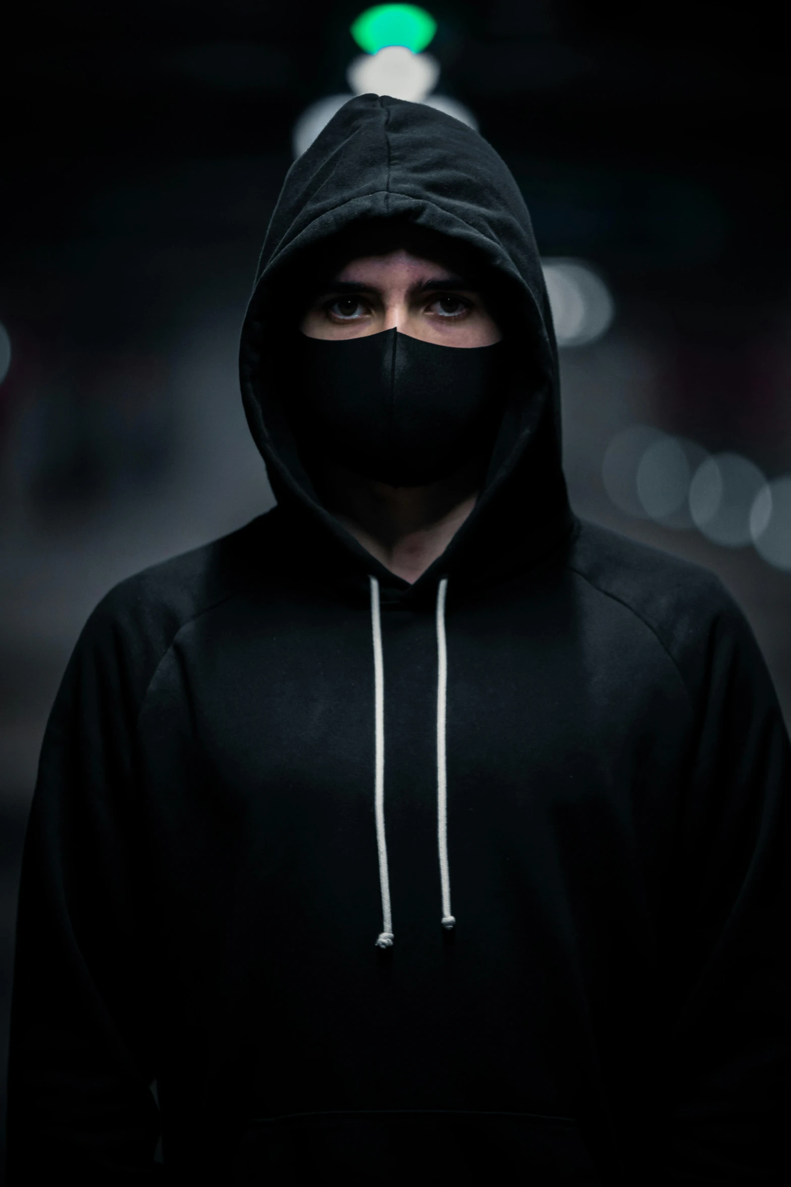 a man wearing a black hoodie and a black mask, an album cover, by Adam Marczyński, pexels contest winner, portrait shot 8 k, discord profile picture, avatar image, street night