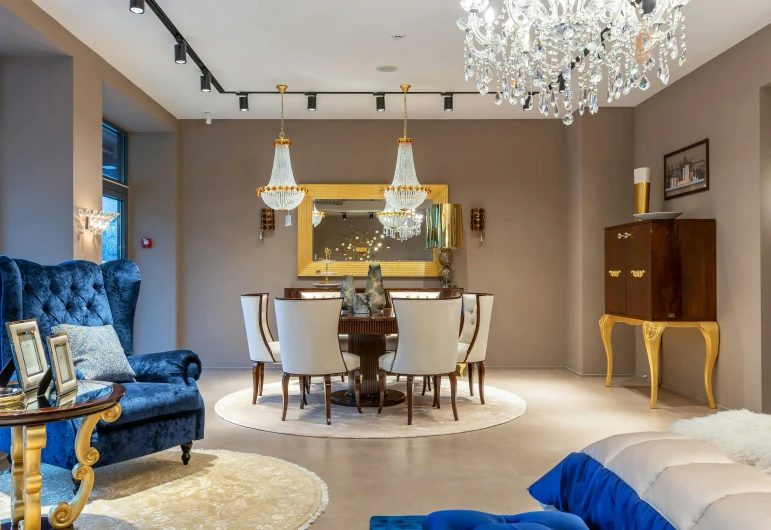 a living room filled with furniture and a chandelier, inspired by Emilio Grau Sala, chaumet style, blue theme and yellow accents, photo for a store, vdragan bibin