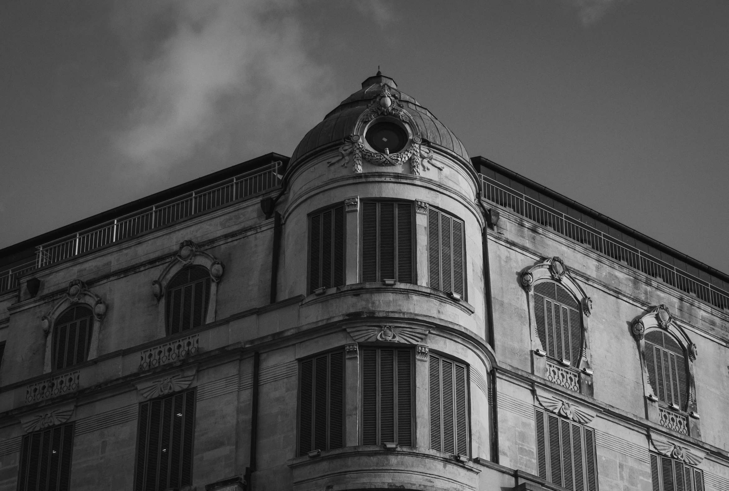 a black and white photo of a building, pexels contest winner, neoclassicism, large windows to french town, detailed medium format photo, rounded roof, photo high definition