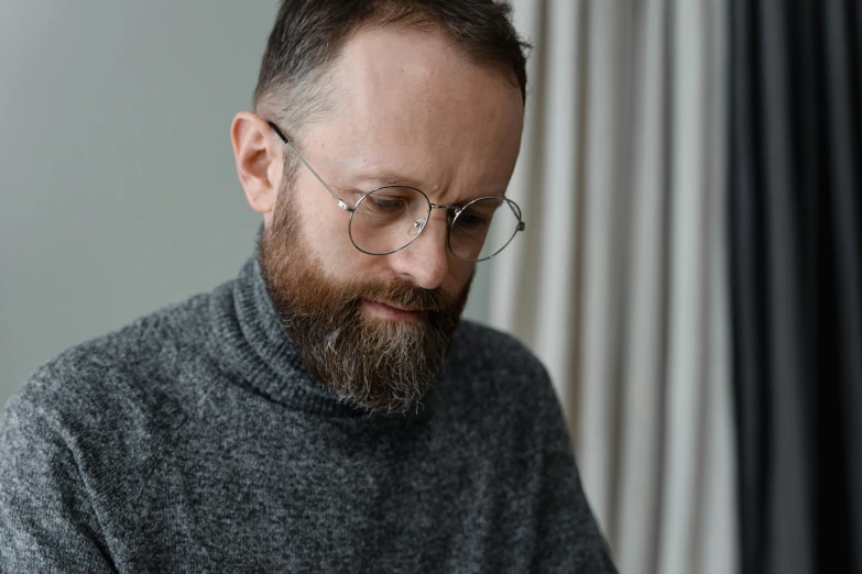 a man with a beard using a cell phone, by Hallsteinn Sigurðsson, trending on reddit, hyperrealism, he is wearing a brown sweater, wearing reading glasses, bending down slightly, peter paul rebens