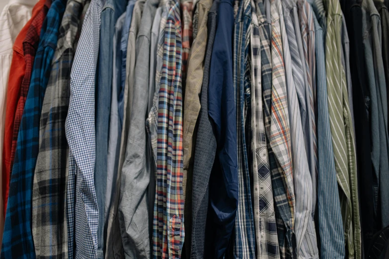 a bunch of men's shirts hanging on a rack, unsplash, clothes made out of veins, wearing plaid shirt, 15081959 21121991 01012000 4k, plastic and fabric