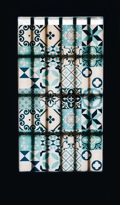 a picture of a window with a pattern on it, inspired by Alberto Morrocco, pexels contest winner, black and teal paper, porcelain, demur, lisbon