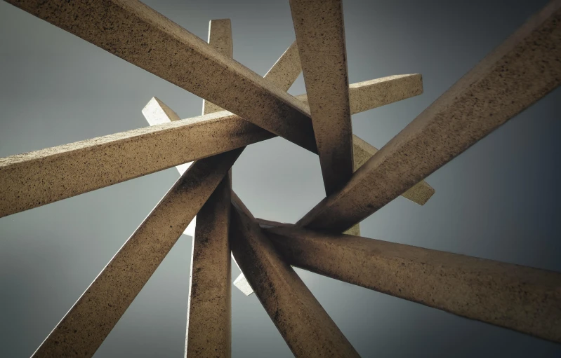 a bunch of wooden sticks sticking out of the ground, an abstract sculpture, inspired by Kay Sage, unsplash, concrete art, octagon render 8k, grain”