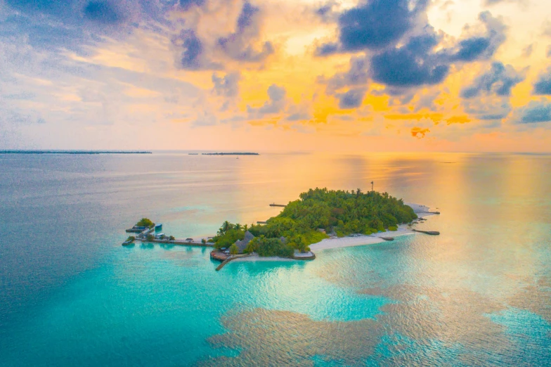 an island in the middle of the ocean at sunset, turquoise water, maldives in background, instagram post, islands