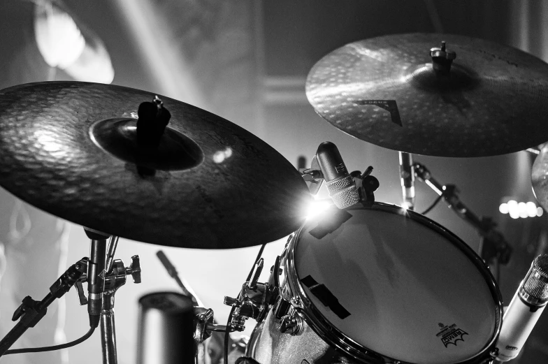 a black and white photo of a drum set, by Dave Melvin, uploaded, active, technologies, gig