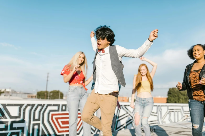 a group of young people standing on top of a skateboard ramp, trending on pexels, happening, dancing character, avan jogia angel, line dancing at a party, avatar image