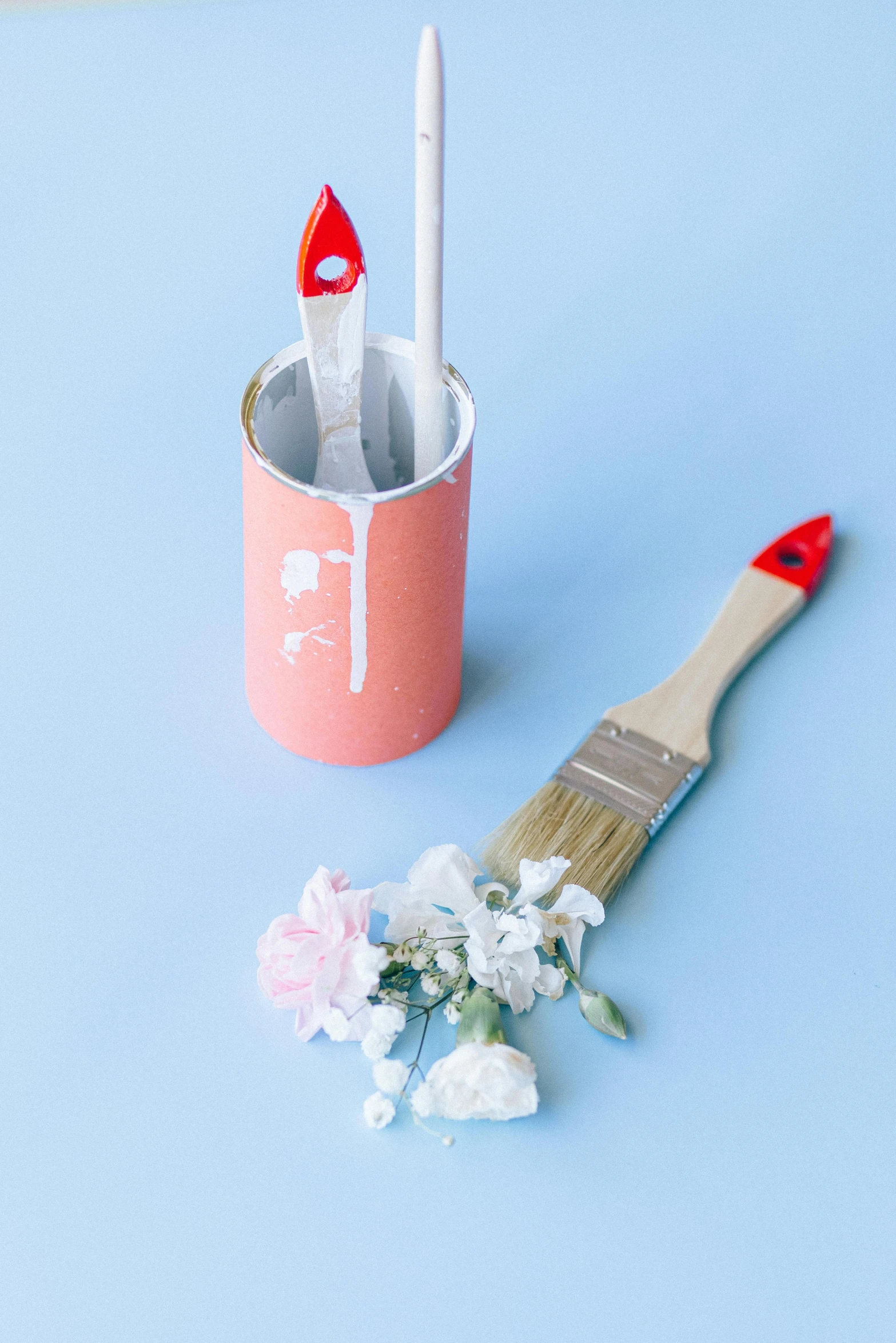 a paint brush sitting next to a paint can, featured on pinterest, jen atkin, blooming flowers, red and white color theme, pastel blue