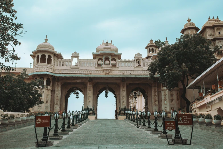 a view of the entrance to a palace, pexels contest winner, hindu aesthetic, square, thumbnail, wes anderson film