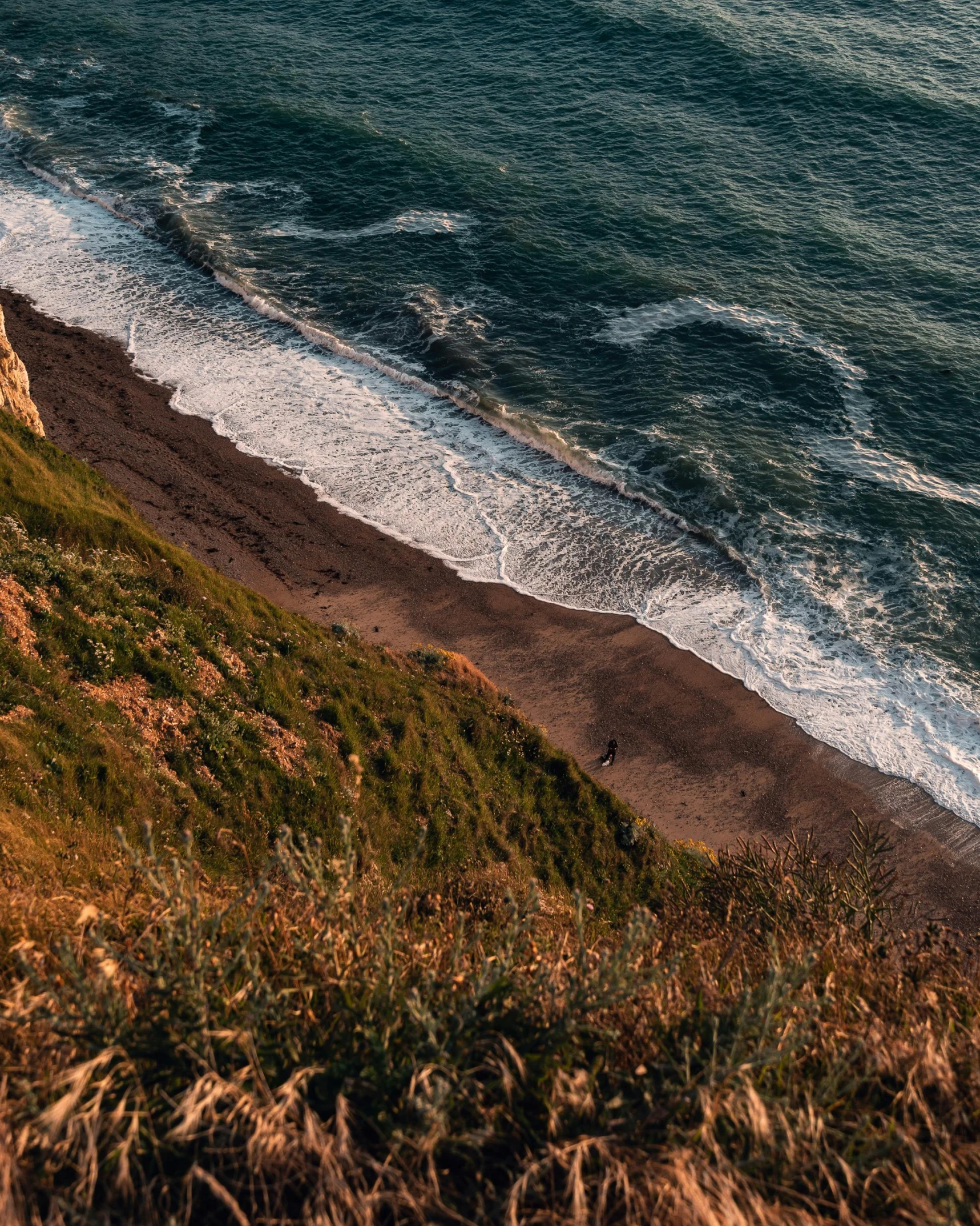 a view of the ocean from the top of a hill, by Elsa Bleda, unsplash contest winner, renaissance, beaching, steep cliffs, thumbnail, profile image