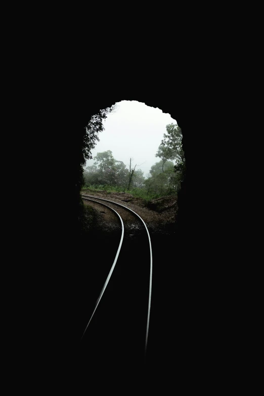 a view of a train coming out of a tunnel, an album cover, by Lucia Peka, dark ambient album cover, ffffound, gopro photo, but minimalist