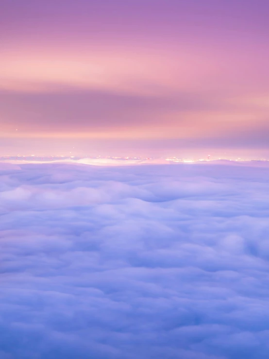 an airplane flying above the clouds at sunset, by Niko Henrichon, pexels contest winner, romanticism, pink and purple, fine art print, blanket of fog, panorama view of the sky