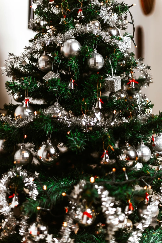a christmas tree decorated with silver and red ornaments, pexels, front closeup, 1 6 x 1 6, a green, multiple stories
