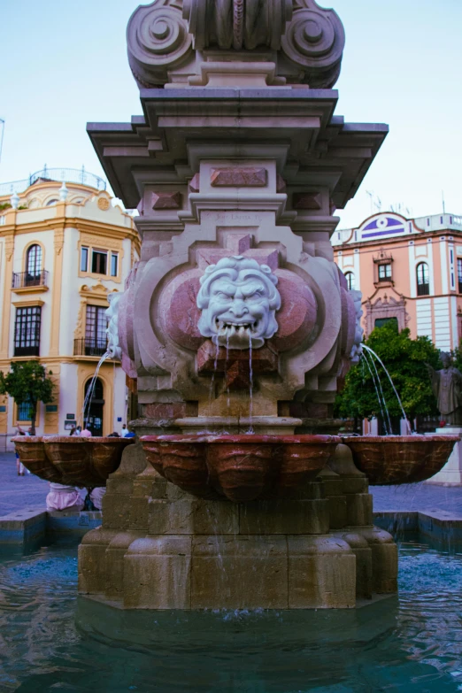 a fountain with a statue on top of it, by Hirosada II, square, center of image, panoramic, third lion head