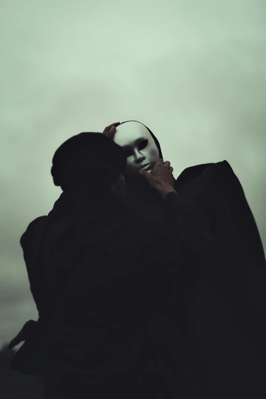 a couple of people standing next to each other, inspired by Nicola Samori, pexels contest winner, romanticism, black mask, marilyn manson, embracing, instagram photo