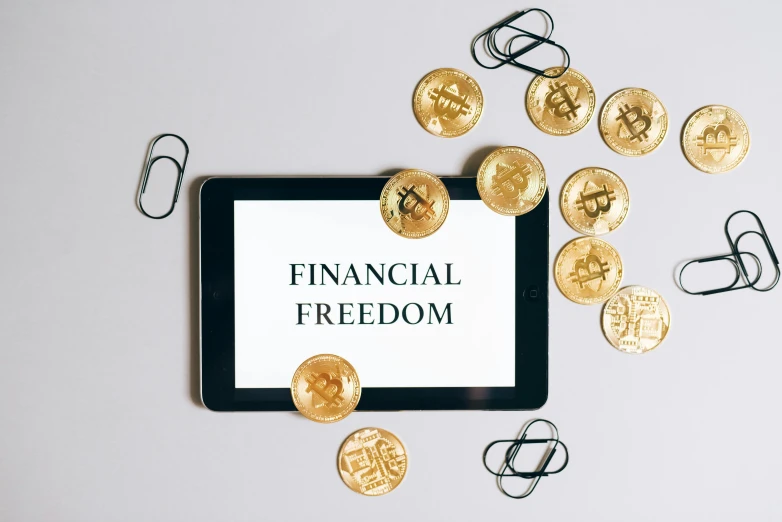 a tablet with financial freedom written on it, a digital rendering, by Anna Katharina Block, trending on pexels, modernism, medallions, crypto, flatlay, patriotism