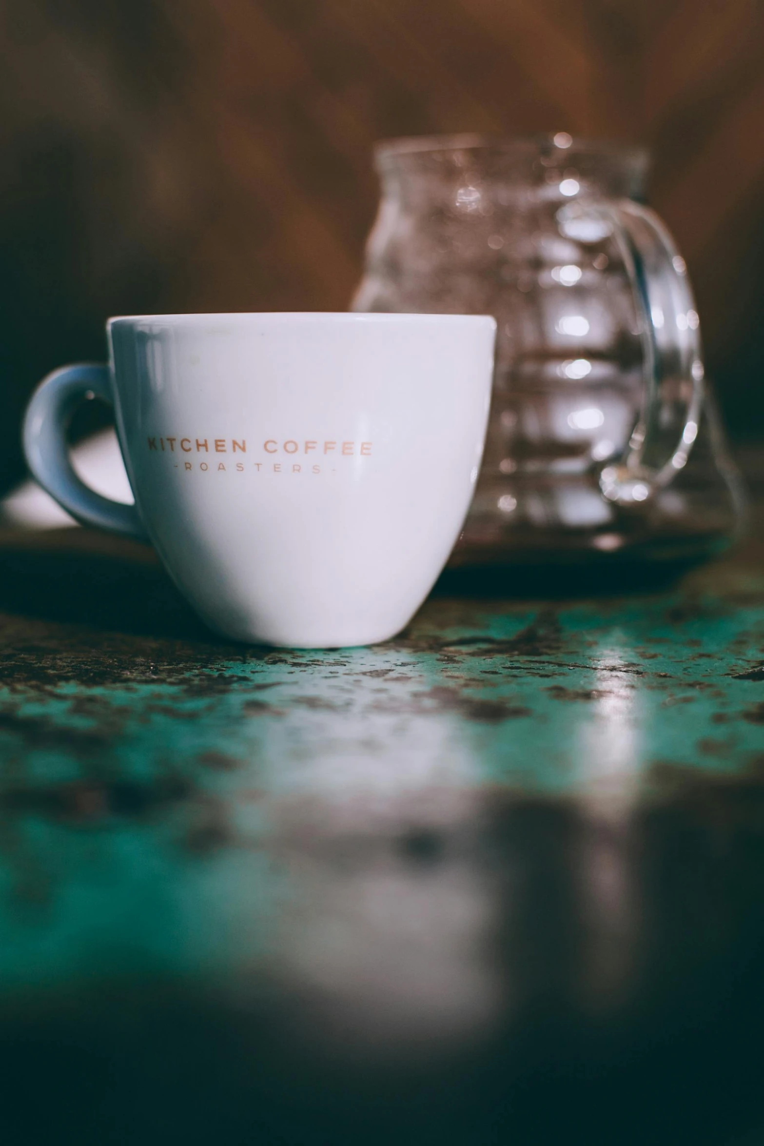 a white coffee cup sitting on top of a table, inspired by Elsa Bleda, kitch, daily specials, up close, hero shot