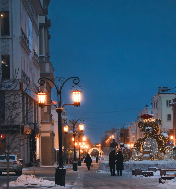 a couple of people walking down a snow covered street, art nouveau, city led lights, tula, very ornamented, faberge