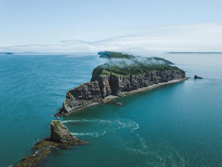 a small island in the middle of the ocean, pexels contest winner, hurufiyya, quebec, flowing cape, hestiasula head, thumbnail