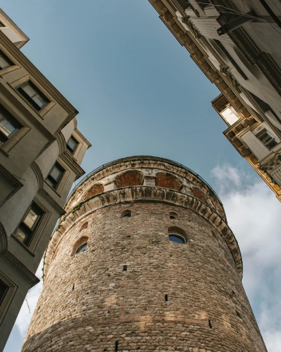 a tall tower sitting between two buildings, pexels contest winner, renaissance, thumbnail, byzantine, round format, low quality photo