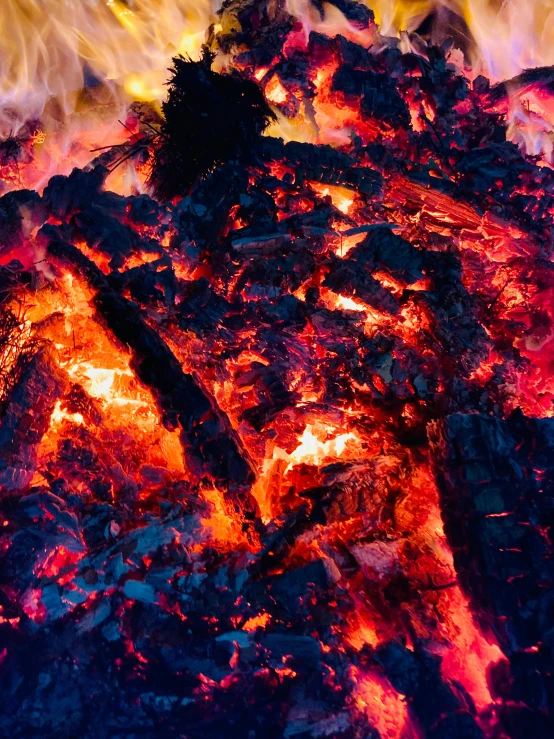 a close up of a fire with flames coming out of it, by Adam Marczyński, fan favorite, volcanic embers, a colorful, pyre