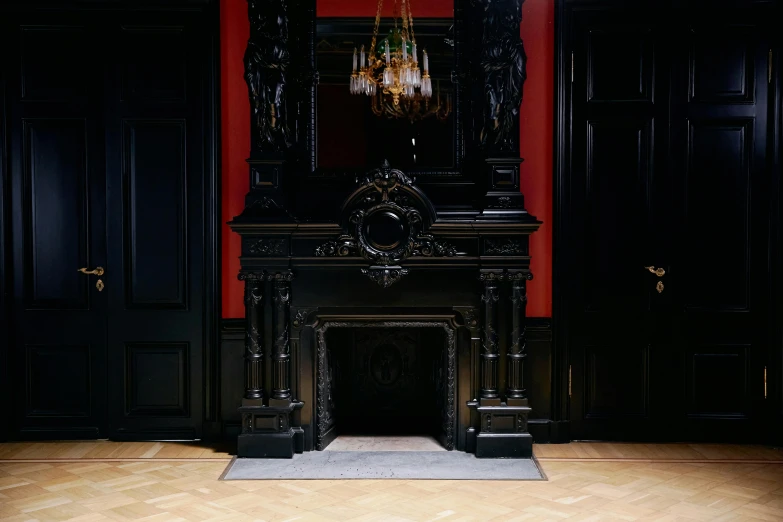 a fireplace sitting on top of a hard wood floor, inspired by Albert Guillaume, black and red scheme, metropolitan museum collection, dan mumfor, black and terracotta