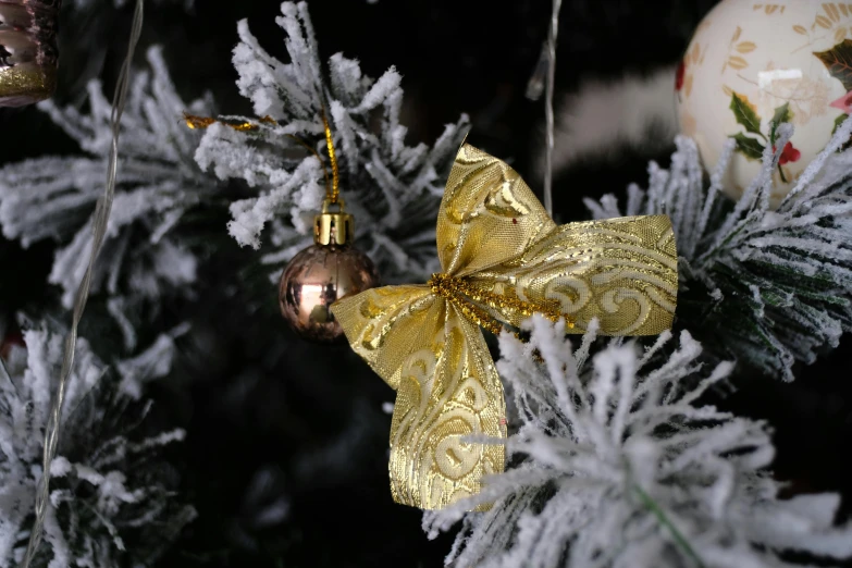 a close up of a christmas tree with ornaments, bowknot, 8 intricate golden tenticles, 8k 50mm iso 10, thumbnail