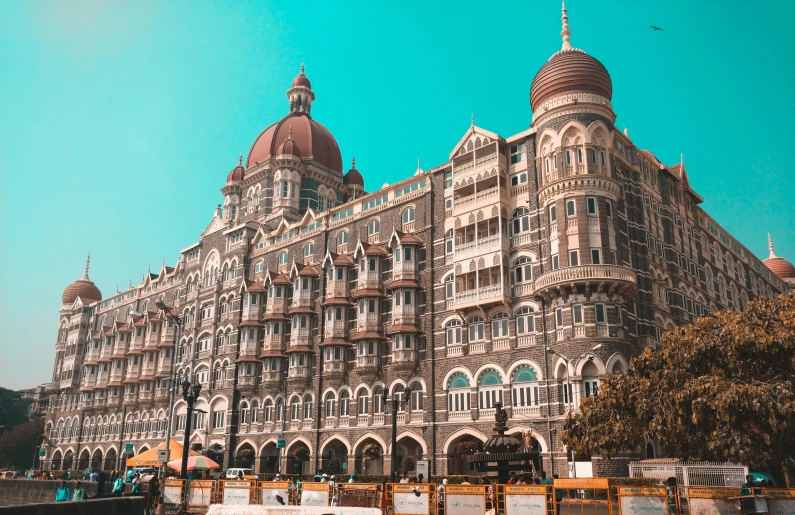 the taj mahal hotel in mumbai, india, pexels contest winner, subtitles, colorful building, brown, thumbnail