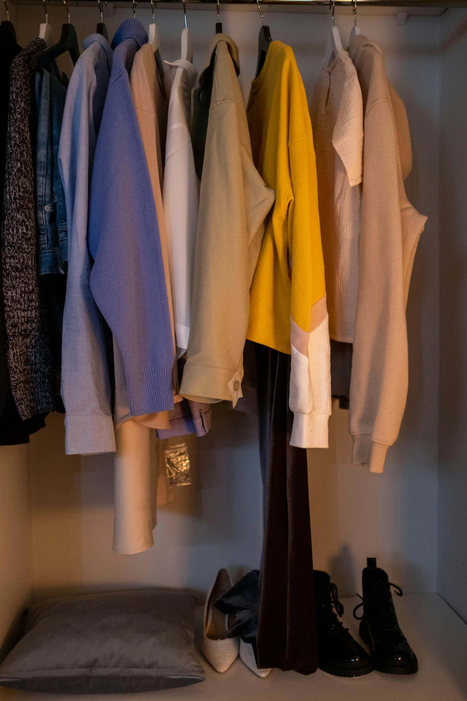 a closet filled with lots of clothes and shoes, by David Simpson, unsplash, muted brown yellow and blacks, lots of pastel colour, marvelous designer substance, hazy