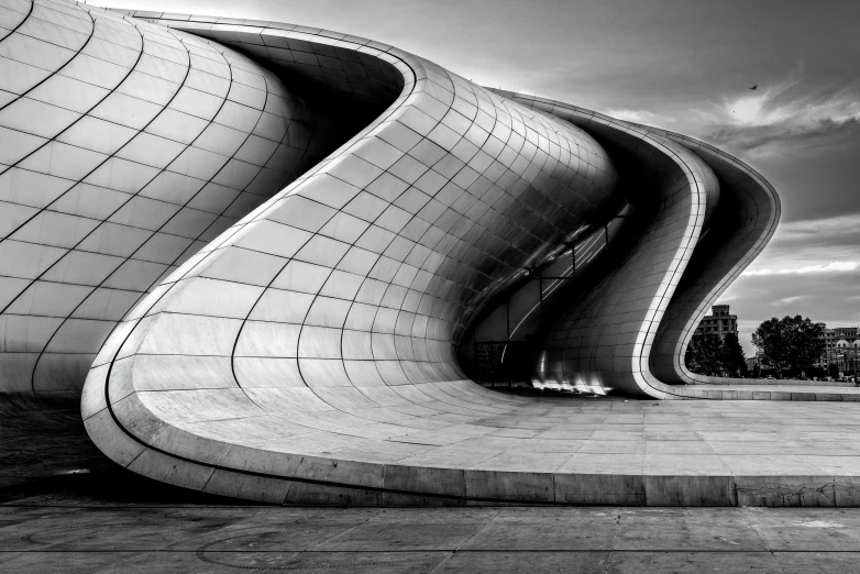 a black and white photo of a curved building, inspired by Zaha Hadid, unsplash contest winner, surrealism, tehran, behance lemanoosh, beautiful!!!! museum photo, serpent
