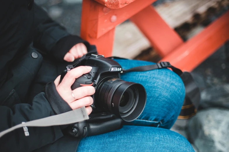 a close up of a person holding a camera, pexels contest winner, photo - realistic nikon 3 5 mm, over the shoulder shot, “the ultimate gigachad, épaule devant pose