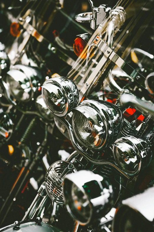 a bunch of motorcycles parked next to each other, pexels contest winner, photorealism, intricate chrome headdress, lights inside, liquid polished metal, detail shot