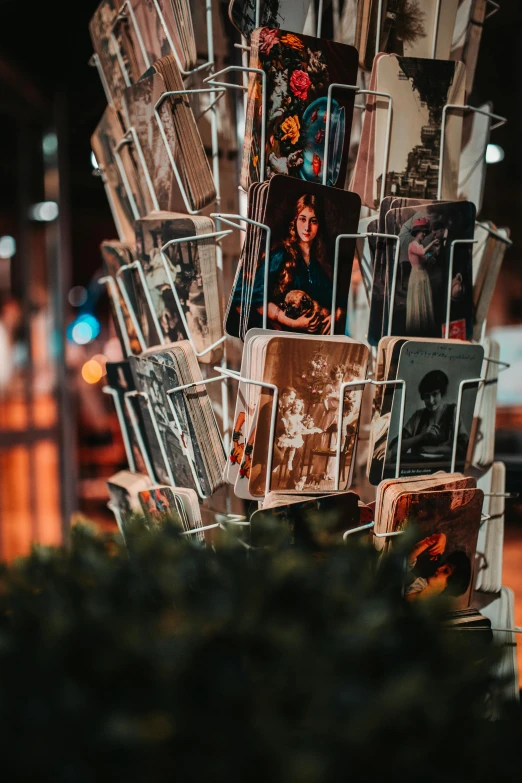 a bunch of cards stacked on top of each other, a polaroid photo, by Daniel Lieske, pexels contest winner, on a candle holder, old retro museum exhibition, portait photo profile picture, 8k 50mm iso 10