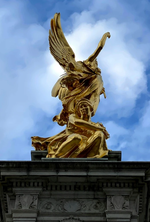 a statue of an angel on top of a building, interior of buckingham palace, slide show, gold wings on head, 2019 trending photo