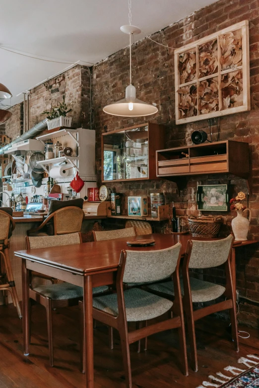 a dining room with a wooden table and chairs, pexels contest winner, maximalism, coffee shop, vintage showcase of the 60s, in chippendale sydney, low quality photo