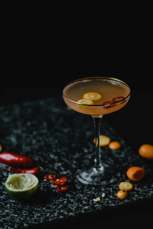 a cocktail sitting on top of a black table, spicy, detailed product image, detail shot, harvest