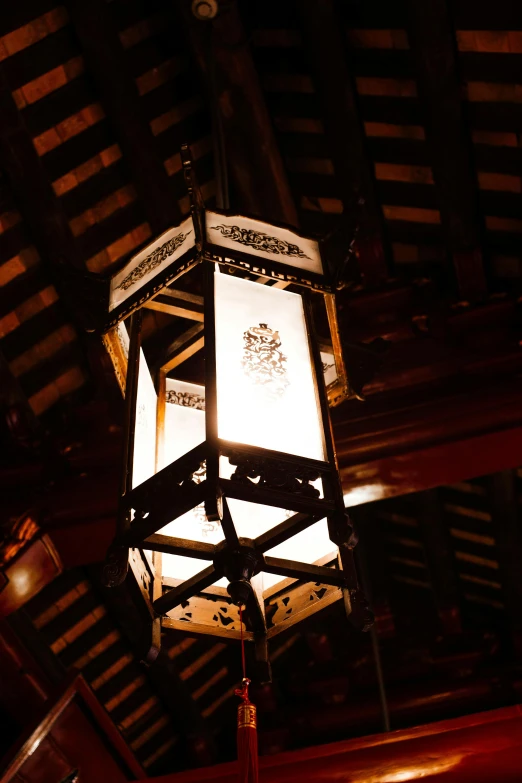 a lantern hanging from the ceiling of a building, a portrait, inspired by Sesshū Tōyō, unsplash, highly detailed soft lighting, tang dynasty palace, dramatic lighting - n 9, medium close shot