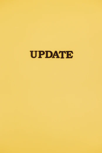 a laptop computer sitting on top of a yellow surface, an album cover, by Damien Hirst, instagram, happening, update, stencil, date, up close image