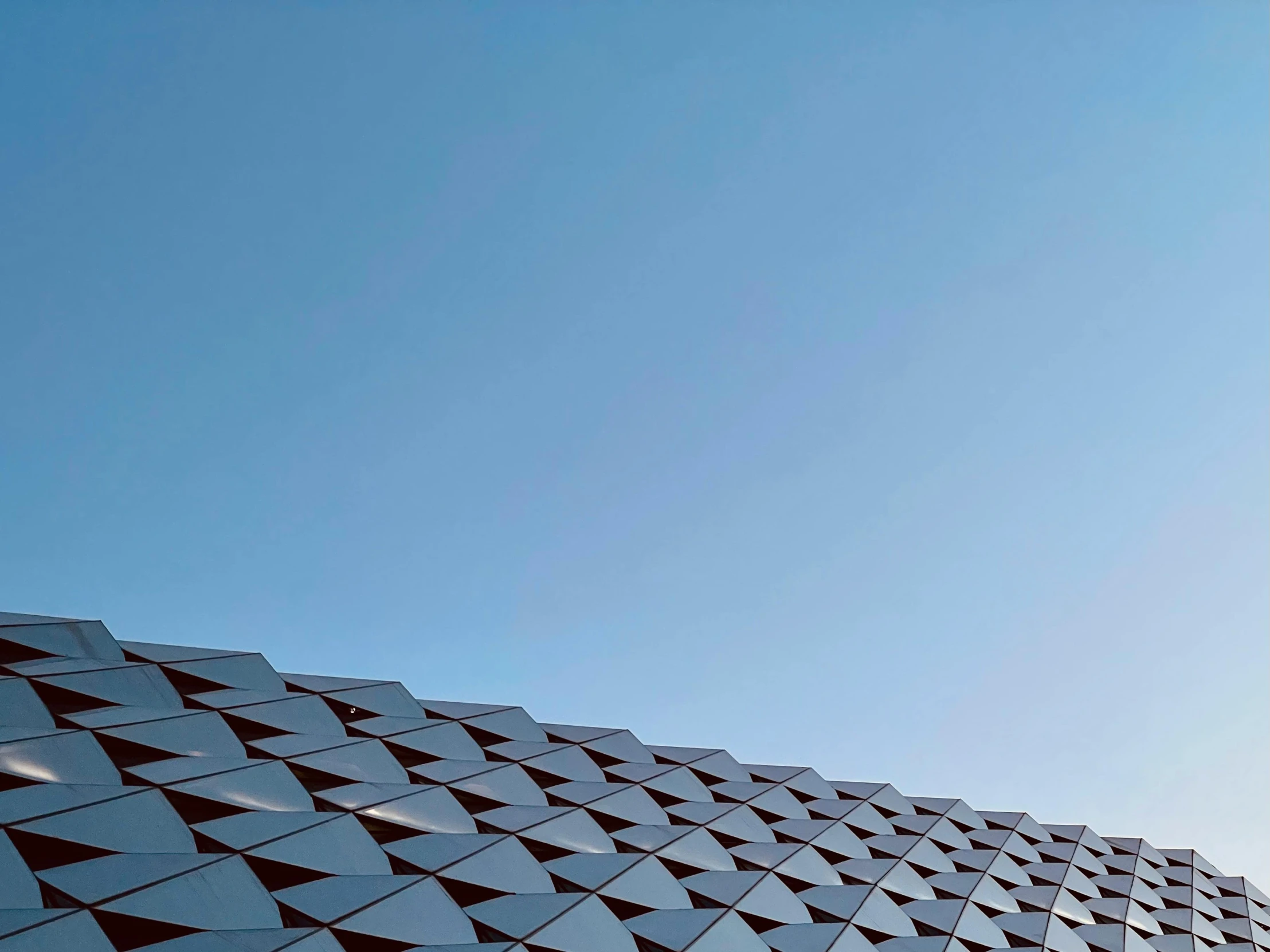 a close up of a building with a sky background, inspired by Zha Shibiao, pexels contest winner, minimalism, “diamonds, cloudless blue sky, tiled, hyperdetailed