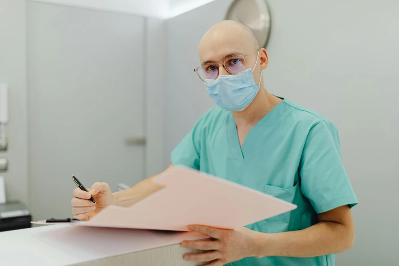 a man in a surgical mask writing on a clipboard, by Emma Andijewska, pexels contest winner, wearing a pink head band, dentist, bald lines, thumbnail