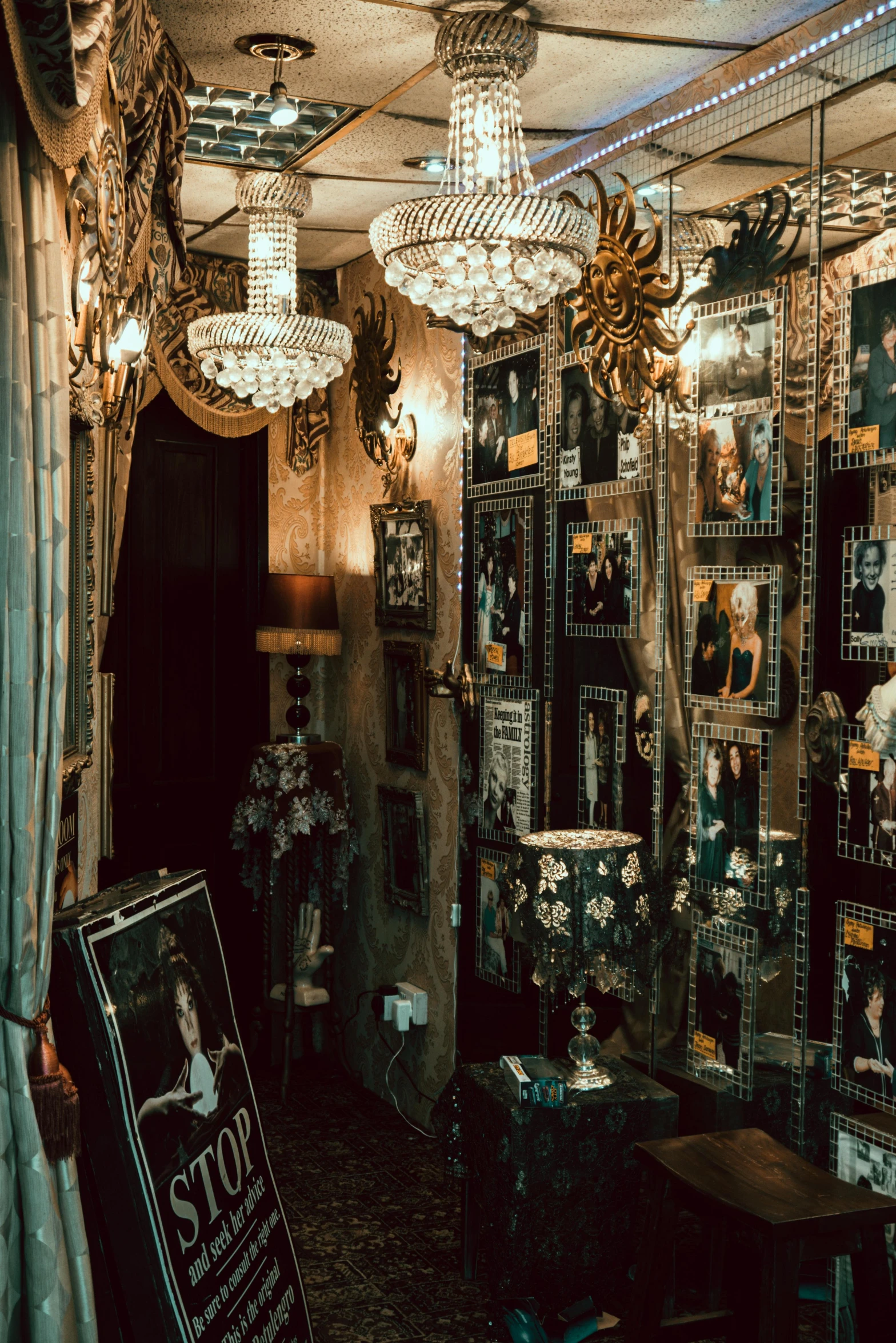 a room with a lot of pictures on the wall, by Elsa Bleda, baroque, theater dressing room, beaded curtains, hollywood promotional image, photo for a store