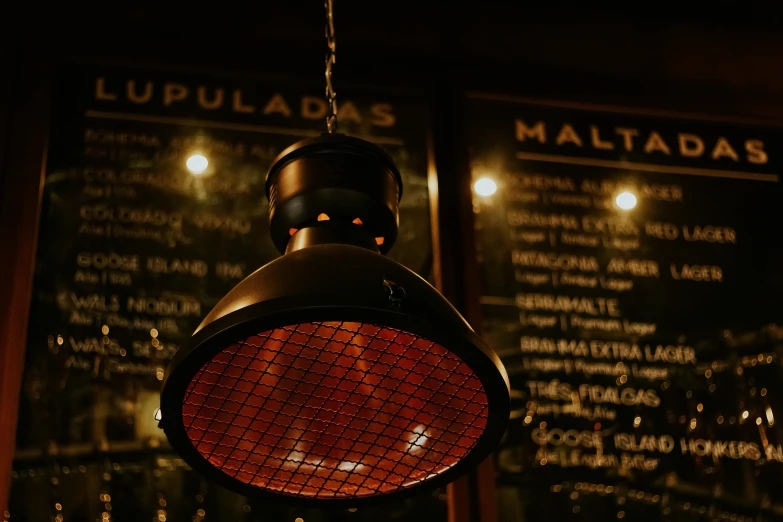 a close up of a light hanging from a ceiling, a screenshot, by Mathias Kollros, unsplash, hurufiyya, speakeasy bar background, hot food, malt, mulato