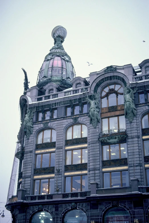 a tall building with a clock on top of it, a colorized photo, inspired by Cornelis Engebrechtsz, art nouveau, helsinki, close up 1 9 9 0, the store, victoria's secret