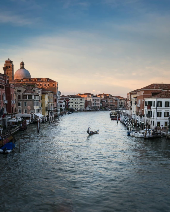 a canal filled with lots of boats next to tall buildings, inspired by Michelangelo Buonarotti, pexels contest winner, renaissance, photo of sophia loren, lgbtq, thumbnail, gondola