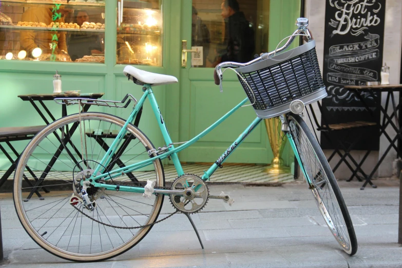 a blue bicycle parked on the side of a street, pexels contest winner, pastel green, 1 9 6 0 s cafe racer, florence, jenny seville
