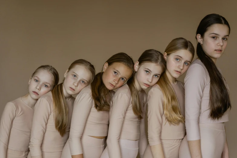 a group of young girls standing next to each other, inspired by Vanessa Beecroft, pexels contest winner, renaissance, motherly, pink, studio photoshot, young girl