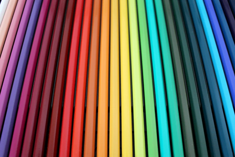 a close up of a bunch of colored pencils, by Rachel Reckitt, rainbow neon strips, brand colours are red and blue, colouring pages, monochrome color