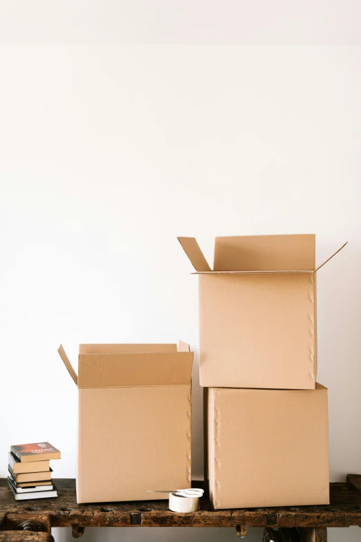 a couple of boxes sitting on top of a wooden table, product image