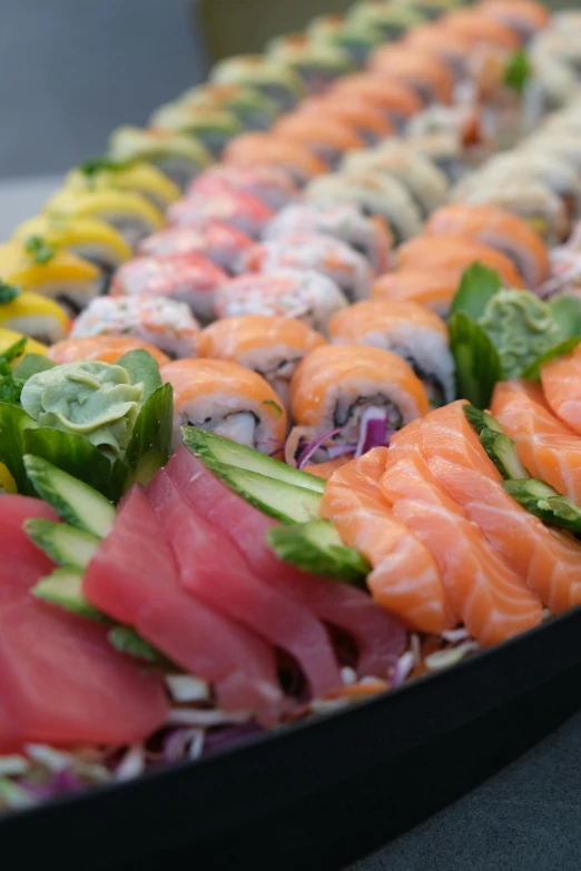 a platter filled with lots of different types of sushi, pro - vida, taken in the late 2010s, upclose, spiraling