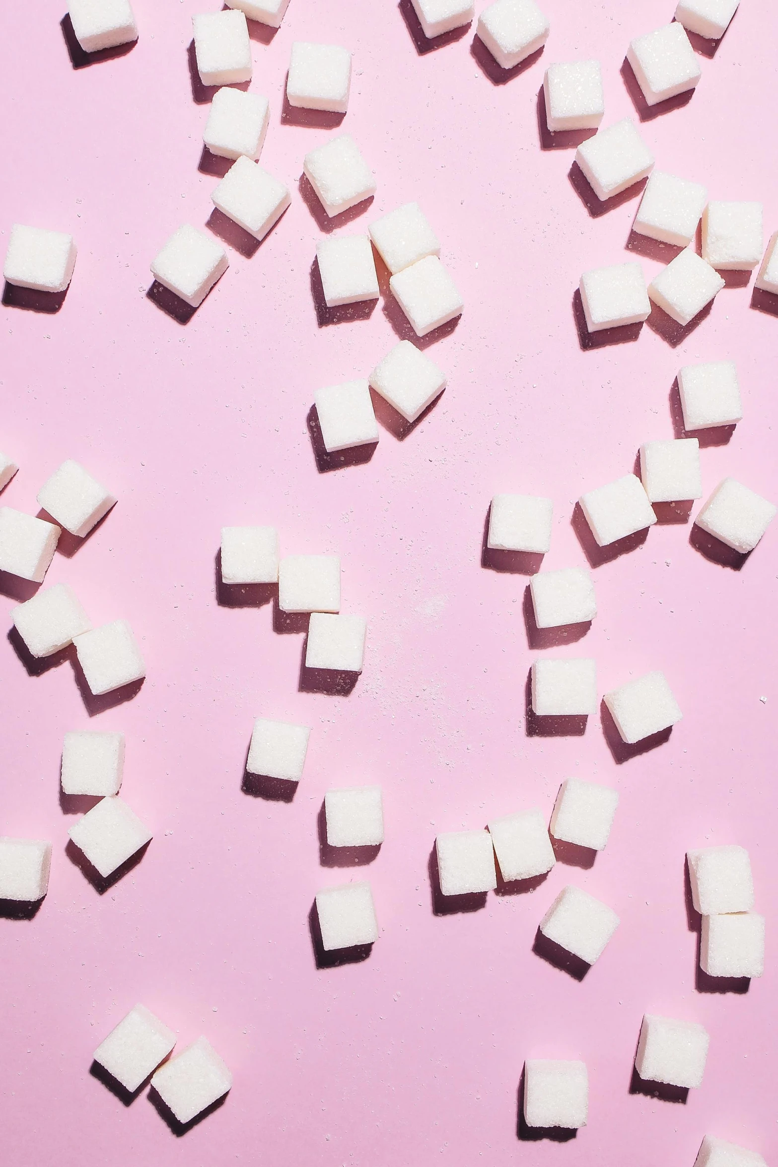 white sugar cubes scattered on a pink background, trending on pexels, pop art, square lines, tan, adafruit, petite