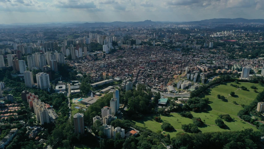 a view of a city from a bird's eye view, by Fernando Gerassi, pexels contest winner, hurufiyya, colombia en los años 60, helio oiticica, park in background, alessio albi